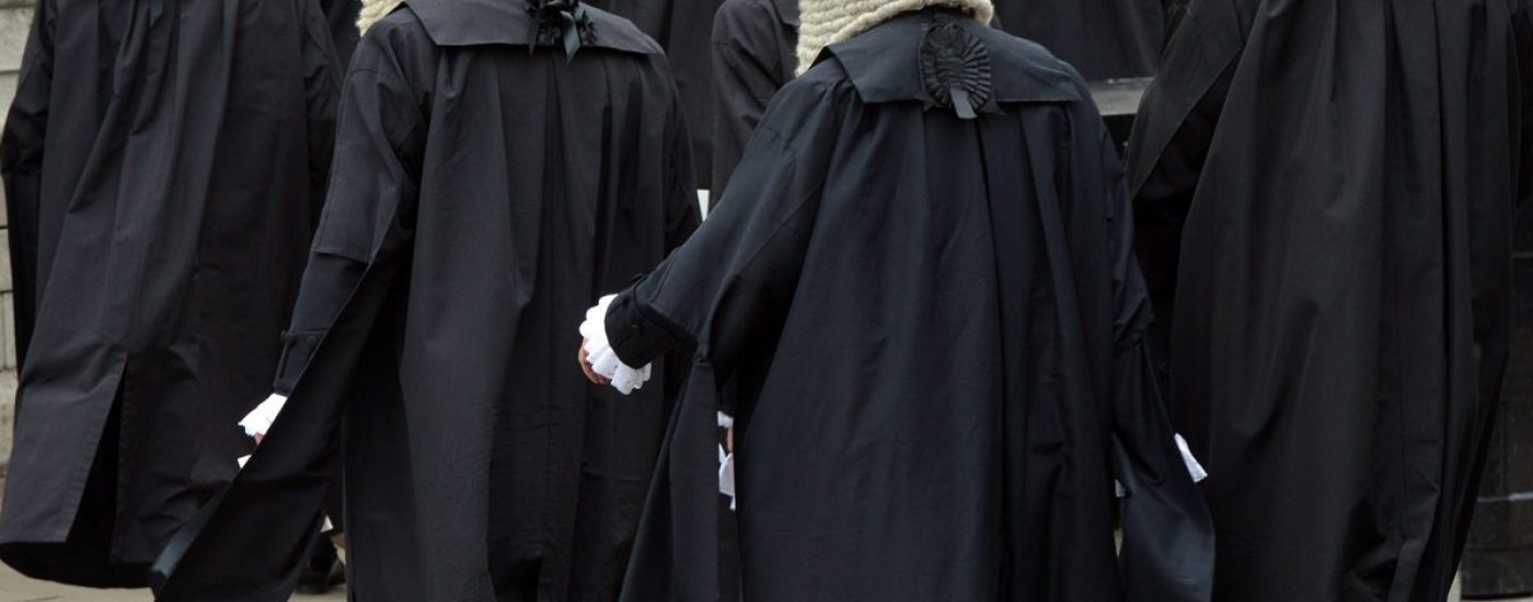 British judges wearing traditional ceremonial wigs and robes in a procession at Westminster, London